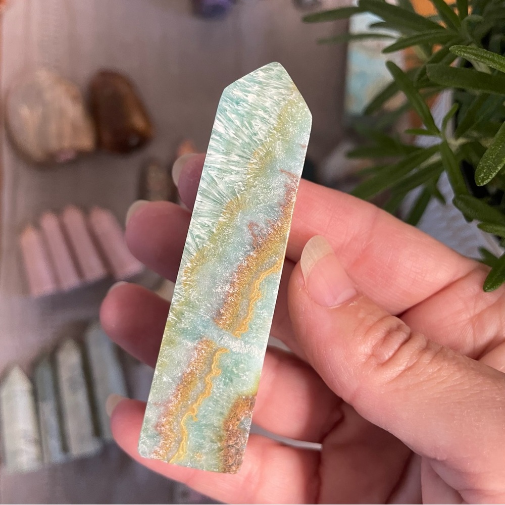 Kiwi calcite crystal tower. Polished crystal four sided tower